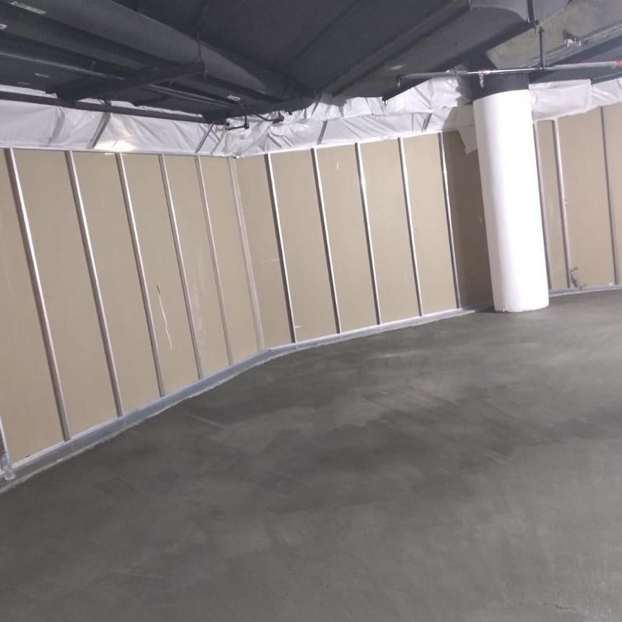 An office floor at One Raffles Place cleared to bare screed with partitions removed